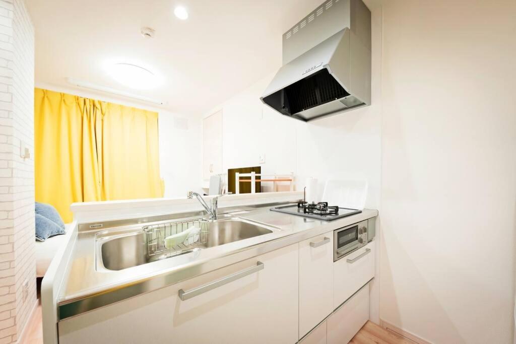 明るい室内で美室を提供　サービスアパ―トメントsapporo南8条 Apartment
